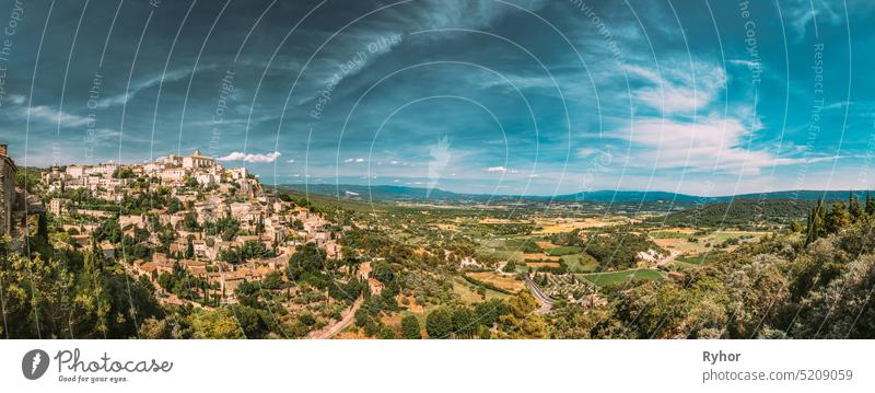 Gordes, Provence, France. Beautiful Scenic View Of Medieval Hilltop Village Of Gordes. Sunny Summer Sky. Famous Landmark. panorama scenic view Cote de Azur