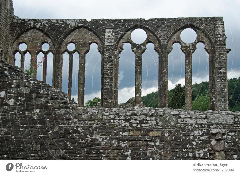 broken windows of a church ruin Church stone church Stone arches stone arch Ruin grey stones Architecture Building Manmade structures Wall (barrier)