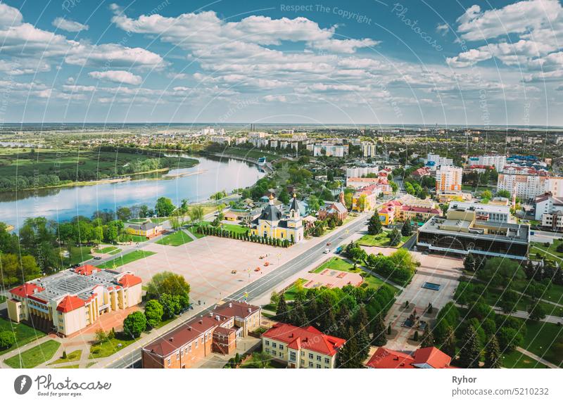 Rechytsa, Belarus. Aerial View Of Residential Houses And Famous Landmarks Of Town: Holy Assumption Cathedral And Holy Trinity Church In Sunny Summer Day.