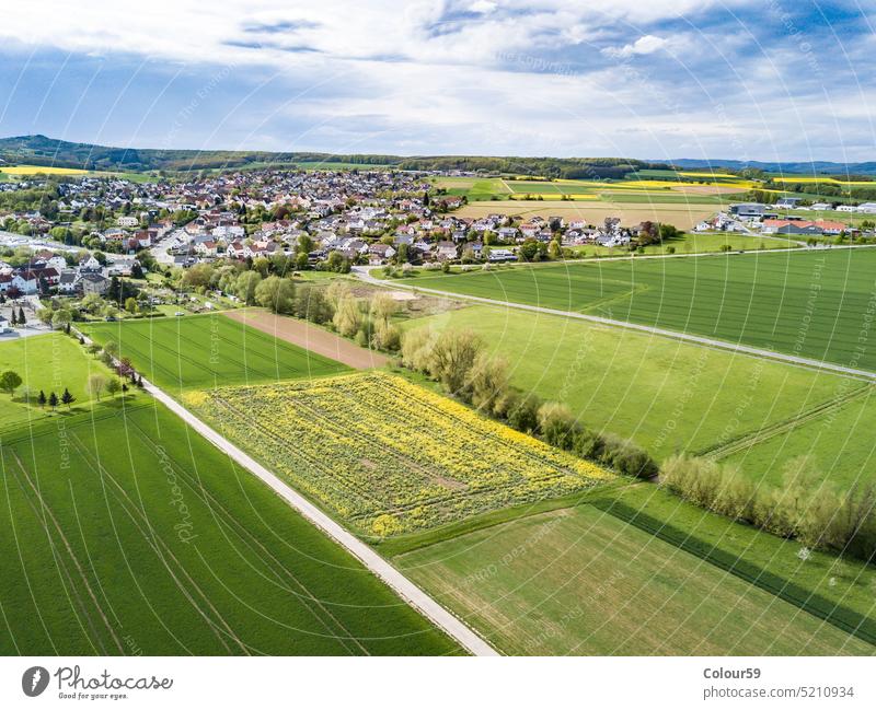 Aerial shot from Landscape in springtime german village country panoramic house building meadows houses panorama flight forest roof aerial shot suburb