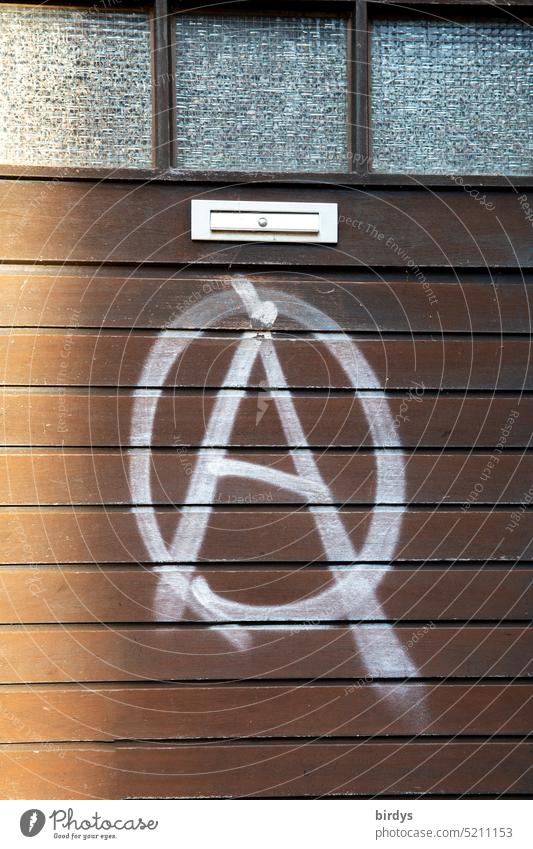 Anarchy, ongespraytes sign on a door System change Revolution Dominationless Self-determination Sign symbol Graffiti Politics and state without hirarchy