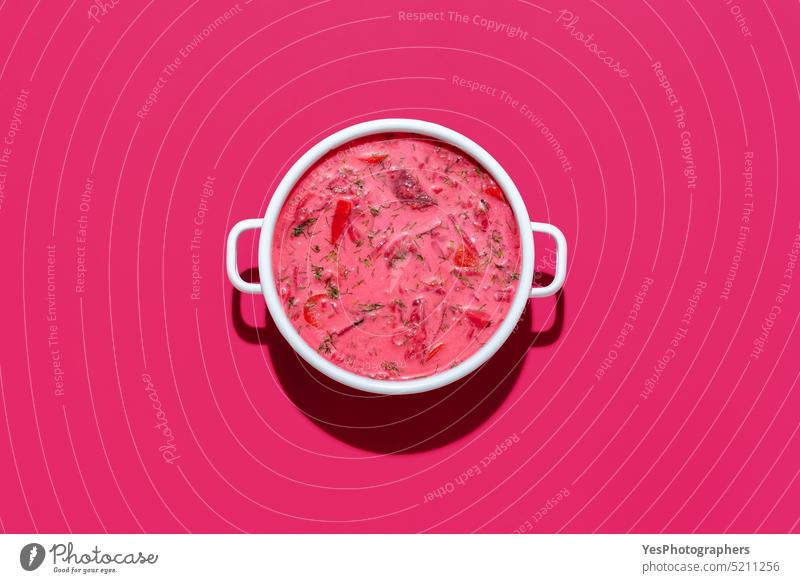 Beetroot soup with sour cream in a white bowl, isolated on magenta background above beet beetroot borsch borscht bright cabbage carrots color copy space cuisine