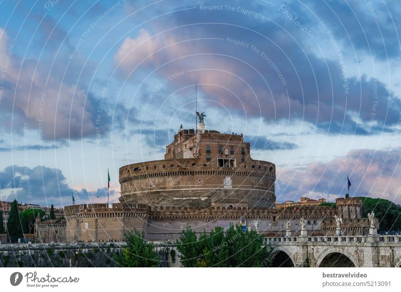 Rome Italy Castel Sant’Angelo evening view with Ponte Sant’Angelo pedestrian bridge visible and puffy clouds above. Castel Sant'Angelo tiber roma