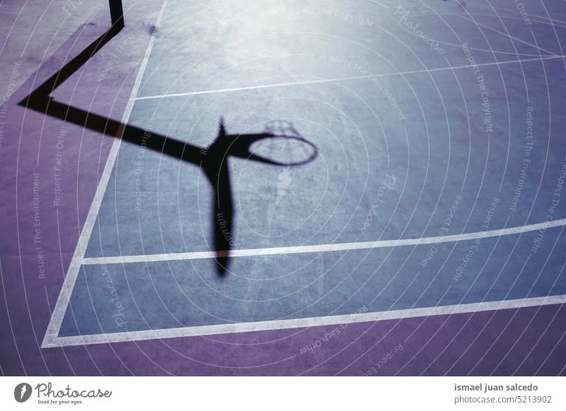 basketball hoop shadow on the basketball court street basket silhouette sunlight ground sports court field sports field equipment sports equipment game play