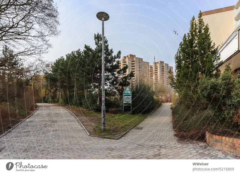 Here you enter the green space in a Berlin residential district and social hotspot Park Green space Kiez Prefab construction skyscrapers High-rise Social