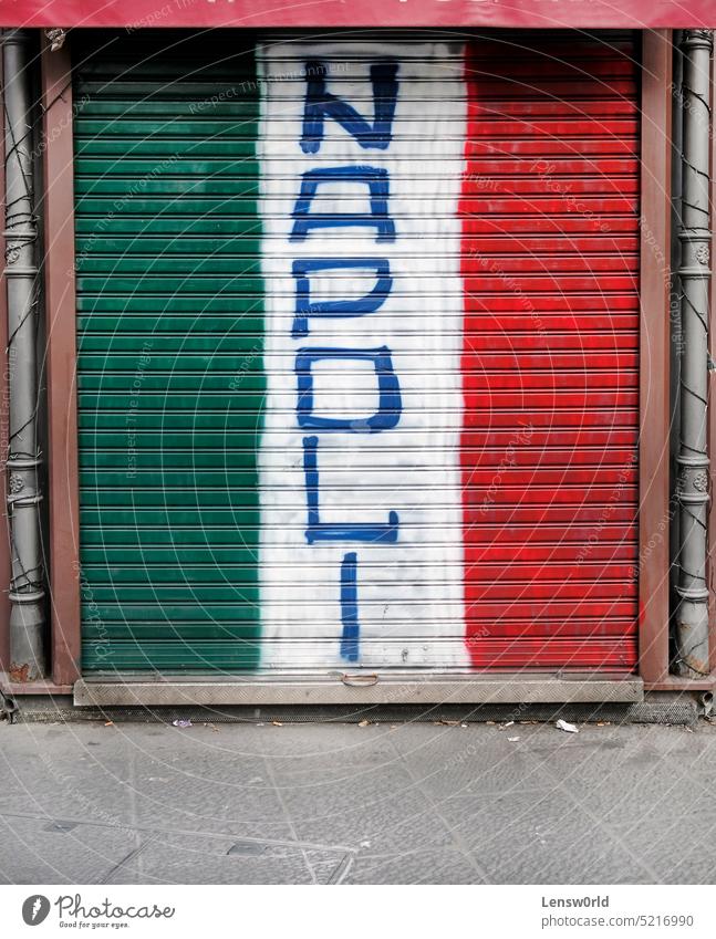 Closed store with an Italian flag and the word Napoli painted on it napoli Naples Italy national flag italy flag neapolitan Graffiti blinds