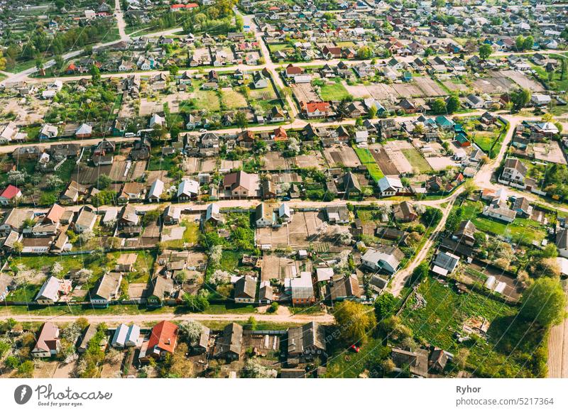 Belarus, Europe. Aerial View Of Small Town, Village Cityscape Skyline In Summer Day. Residential District, Houses And Vegetable Garden Beds In Bird's-eye View