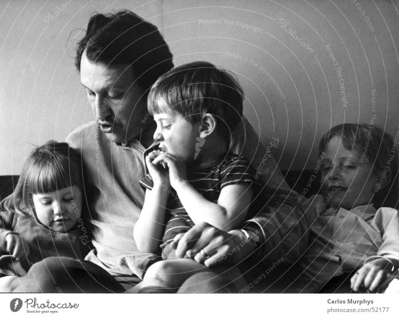 family stories Family & Relations Child Daughter Son Father Reading Read out loud Love Trust Calm Past Novella Black & white photo children To talk