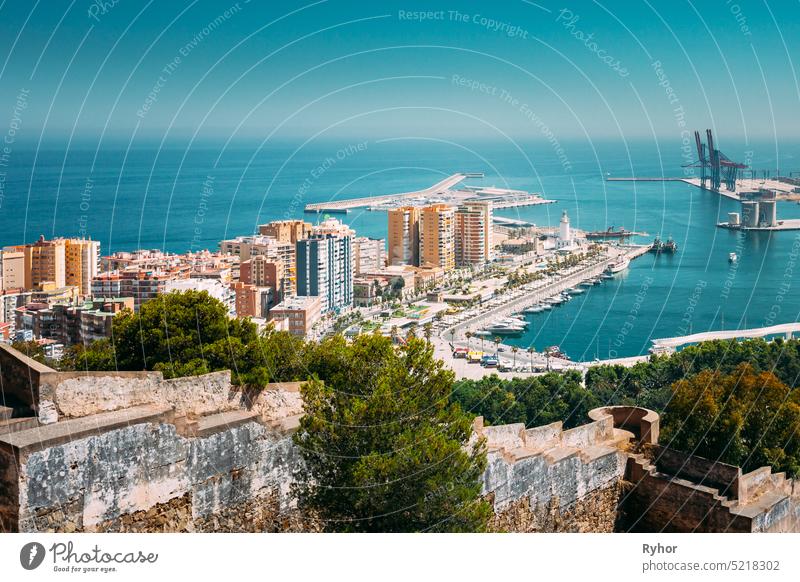 Malaga, Spain. Elevated View, Cityscape View Of Malaga, Spain. Old Fort Walls And Residential Houses europe spain andalusia mediterranean Costa del Sol