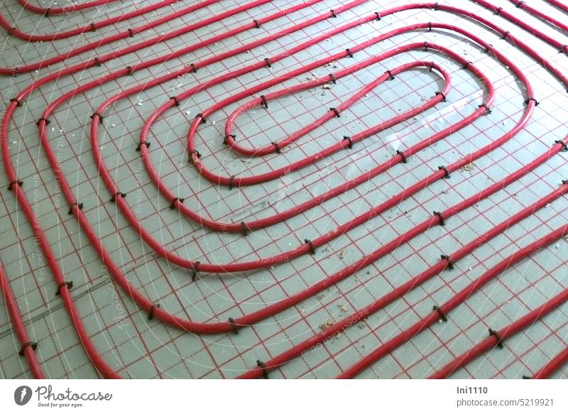 Heating circuit with red plastic pipes for a floor heating system Construction site New building construction industry interior finishing installation