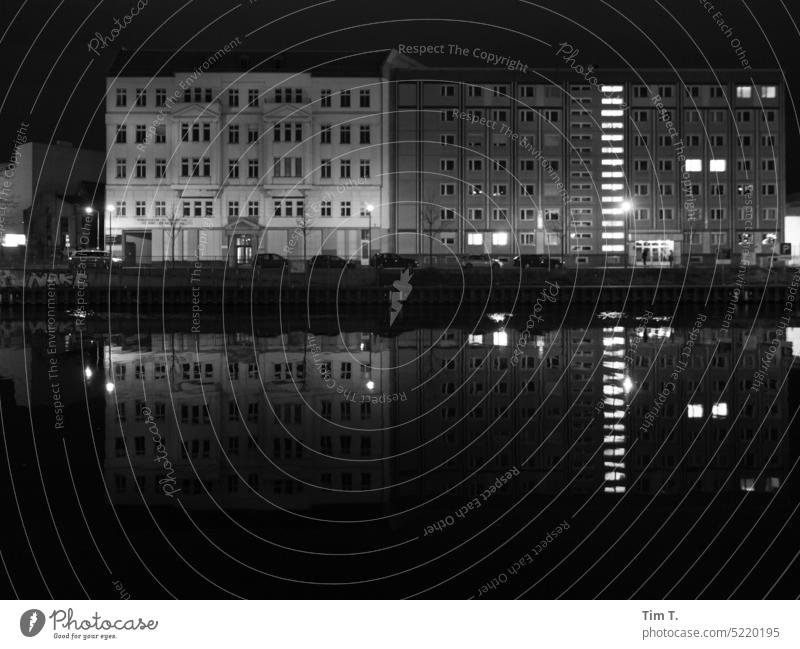 Old and prefabricated building on the Spree Berlin Night b/w Prefab construction Old building Reflection Black & white photo Downtown Deserted Architecture Town