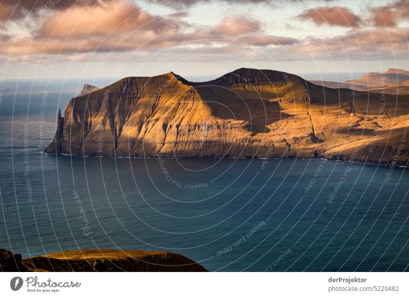 View over landscape and fjord in sunlight Street rocky Bad weather Environment Hill Rock highlands Rural harmony Weather Picturesque Faroe Islands Sunlight