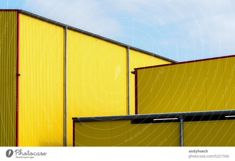 Facades of yellow warehouse with blue sky abstract aluminum architectural architecture backdrop Background building Business clean construction copy space