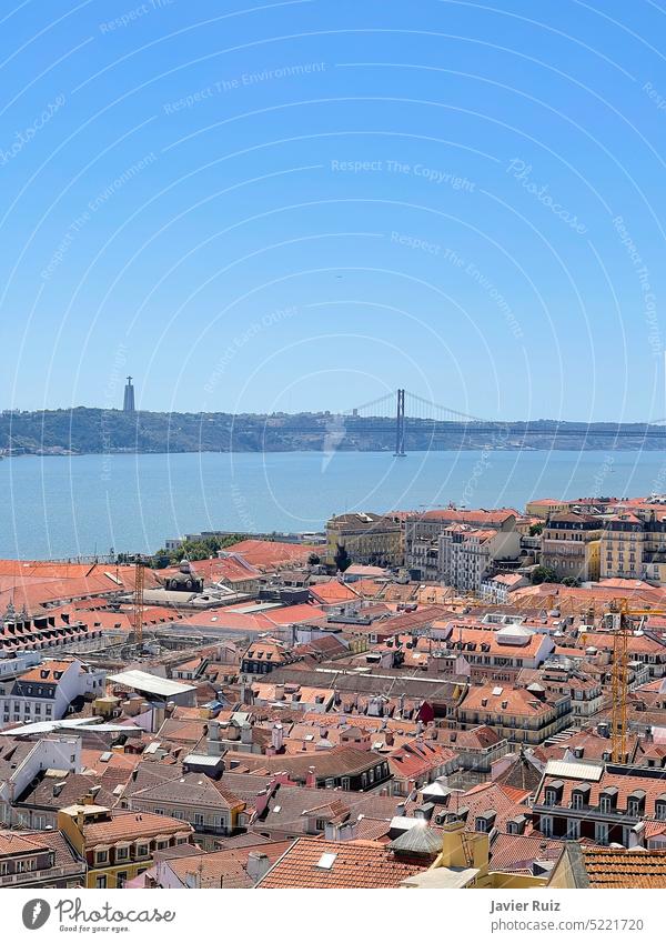 View of the city of Lisbon from the top of St. Georg castle with the 25th of April bridge over the Tagus river, vertical lisbon lisboa portugal