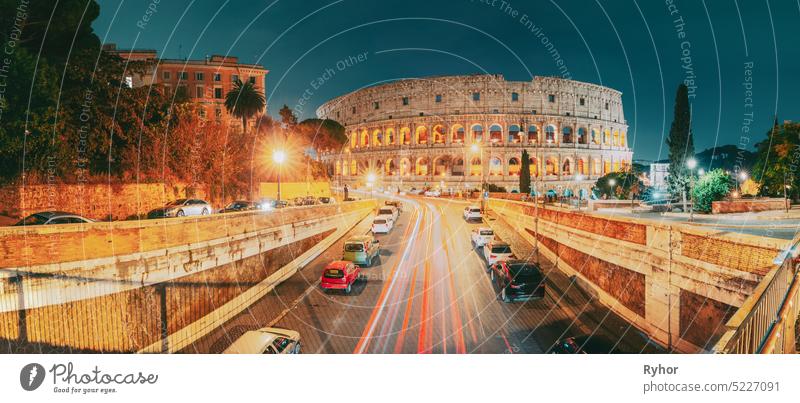 Rome, Italy. Colosseum Also Known As Flavian Amphitheatre. Traffic In Rome Near Famous World Landmark In Evening Time. Amphitheater Coliseum Roma