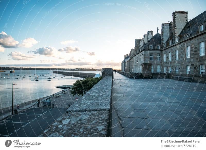 Row of houses with wall by the sea with evening atmosphere Wall (barrier) Town France travel Tourism Brittany Vacation & Travel Landscape Exterior shot Sky