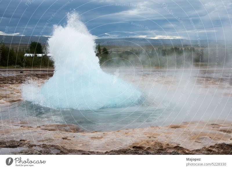 Amazing geyser in Iceland, Europe golden circle famous sky clouds drop explosion fountain eruption power energy spray strokkur thermal volcanic geothermal