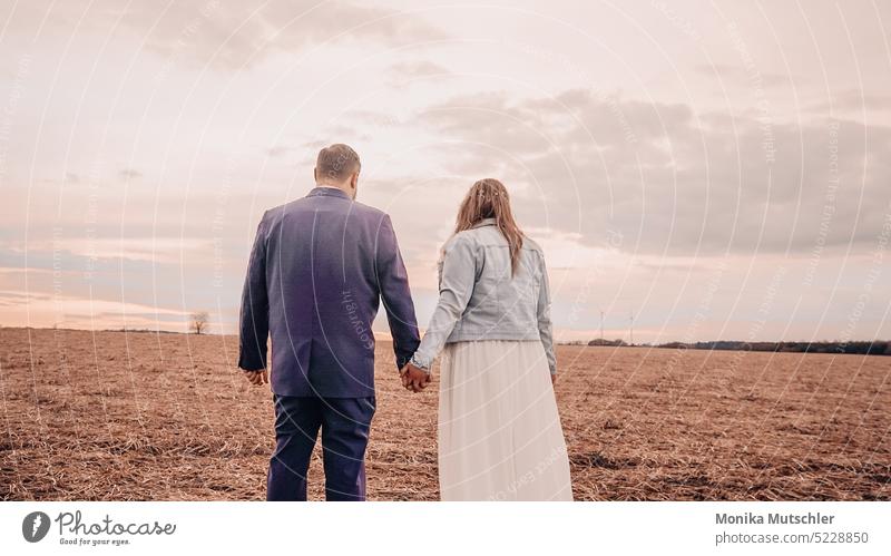 Hand in hand - for a lifetime faithful Exterior shot Colour photo Wedding marriage Love Romance romantic Bride Married Couple Together Happy youthful Woman