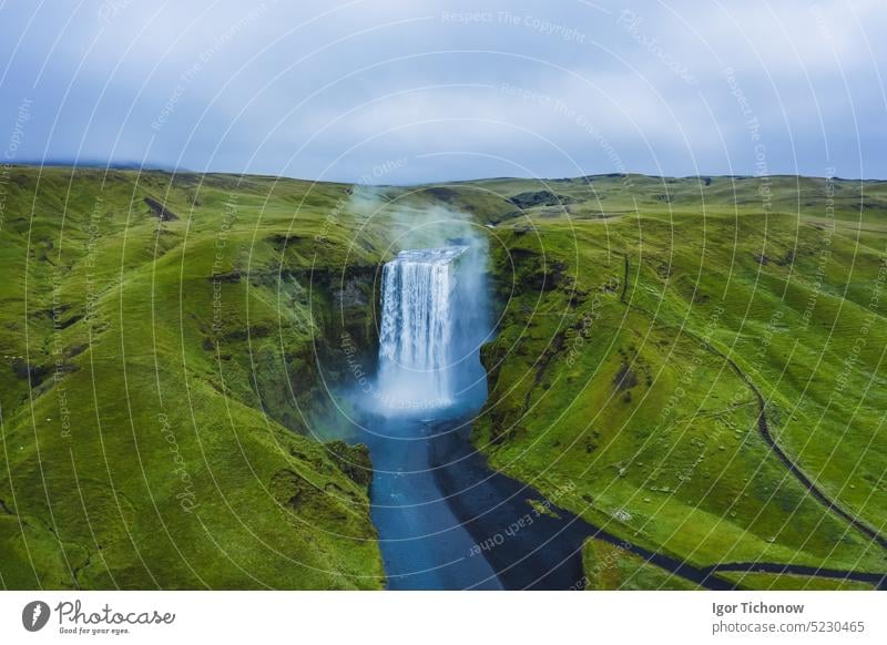 Aerial drone view of Skogafoss waterfall in Iceland, one of the most famous tourist visited attraction and landmark landscape aerial beautiful iceland south
