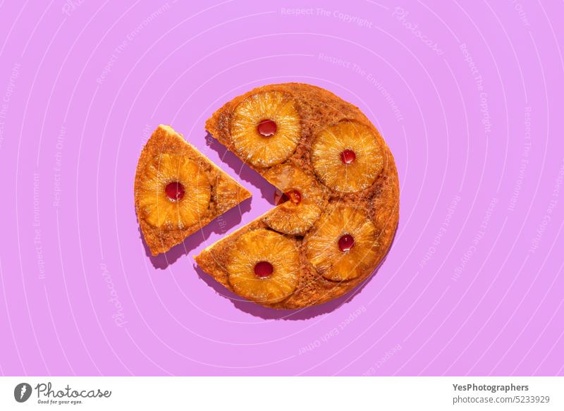 Pineapple tart isolated on a purple background. Upside down cake with pineapple above ananas baked bakery bright caramel color cuisine cut out delicious dessert