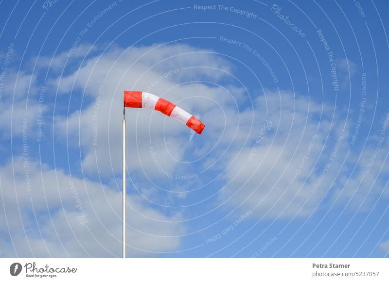 Windsock III Sky Red Blue Clouds White Wind direction Striped Aviation Air Flying Deserted Exterior shot Weather Colour photo Blow