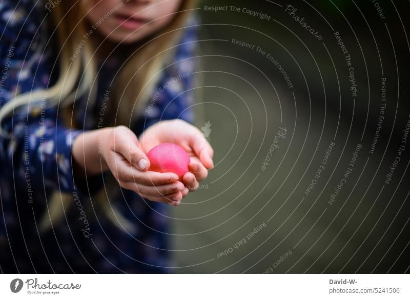Girl with an Easter egg in her hands Find stop found Child Infancy Spring Feasts & Celebrations Tradition Egg Easter eggs