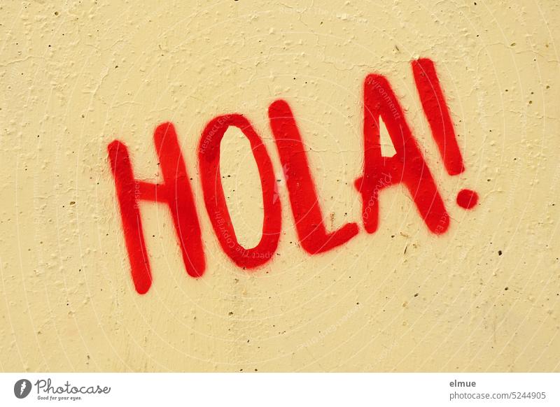 HOLA ! is written in red on a beige concrete wall / graffiti Hola Hello Hi! Spanish Welcome Good day! Holla month Hello God Communicate Blog Salutation Daub
