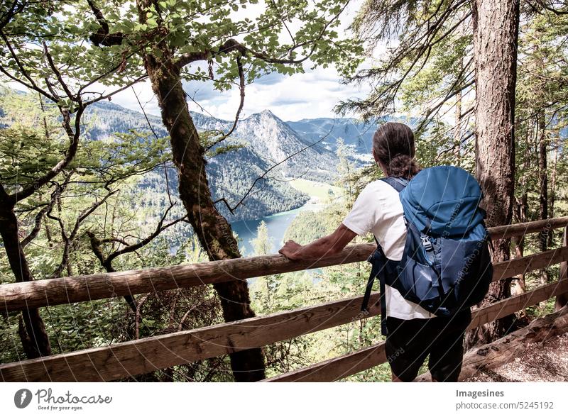 Hiker in the Alps. Backpacker Tourist. Hiking at Königssee - route, circular hiking trail Malerwinkl at Königssee - Berchtesgaden Alps, Bavaria, Germany. hikers