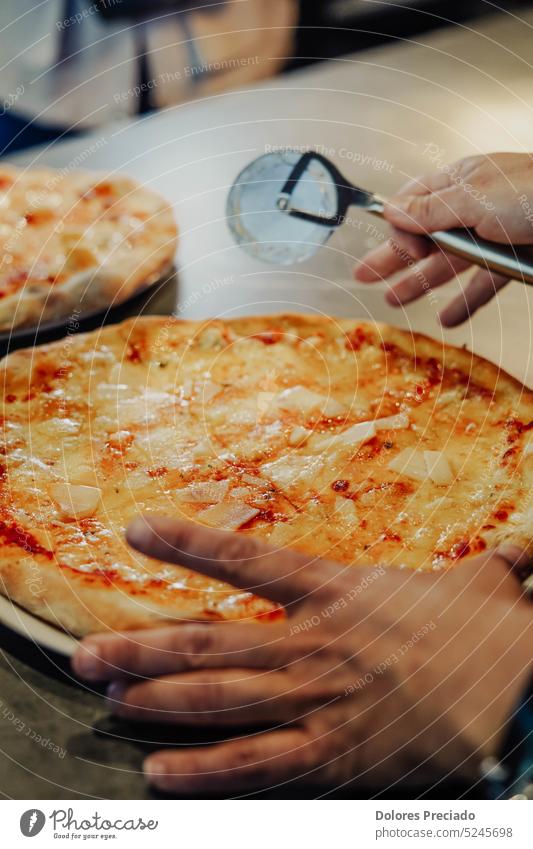 Homemade Italian-style pizza. Freshly kneaded dough, hand crushed tomatoes, and a perfect blend of mozzarella and parmesan cheese make this pizza a true work of art