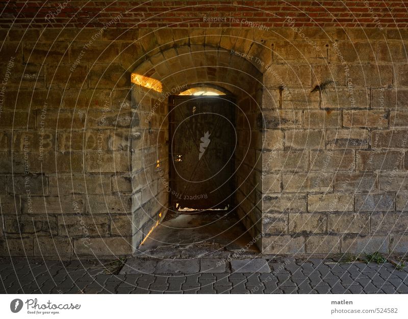 glimmer of hope Deserted Manmade structures Wall (barrier) Wall (building) Door Stone Metal Illuminate Brown Gray Hope Rust Keyhole Colour photo Subdued colour