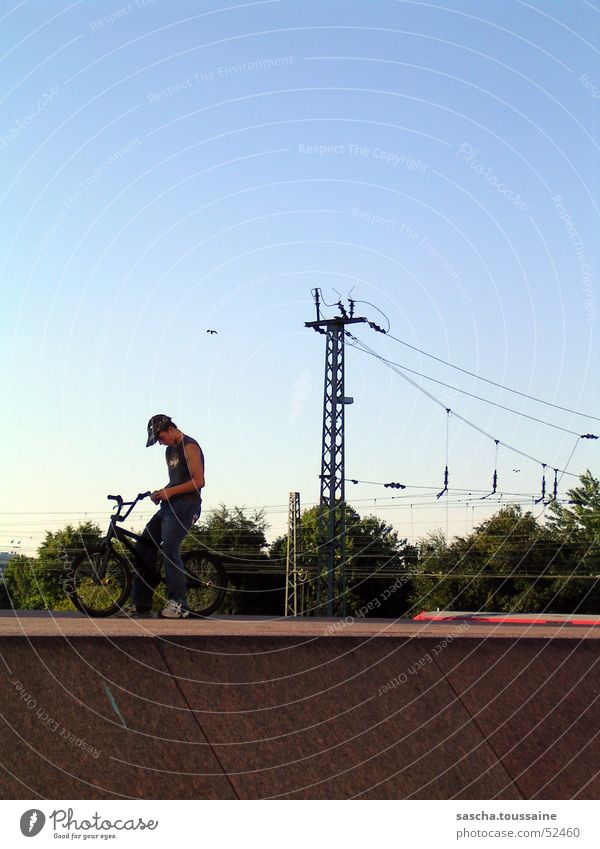 free-style-standing-extreme Freestyle Bicycle Cycle race Man BMX bike Motorcyclist Style Street art Dirt Jumping Overhead line Underground Commuter trains