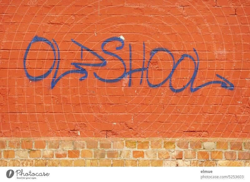 OLDSHOOL is written in blue on a red brick wall oldshool Oldschool English old school Classic nostalgically Blog Archaic Graffiti as before well-tried