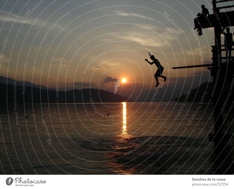 Jumping into cold water II Sunset Lake Clouds Water Sky Mountain