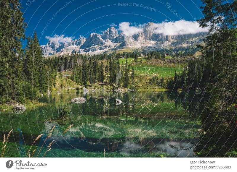 Carezza lake - Lago di Carezza, Karersee with Mount Latemar, Bolzano province, South tyrol, Italy. Landscape of Lake Carezza or Karersee and Dolomites in background, Nova Levante, Bolzano, Italy
