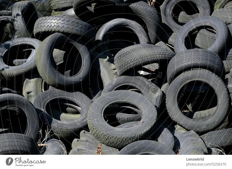 Pile of old tires in the sun black car dumpster garbage garbage dump industry pile pile of garbage pile of tires pollution rubber tyre tyres used waste wheel