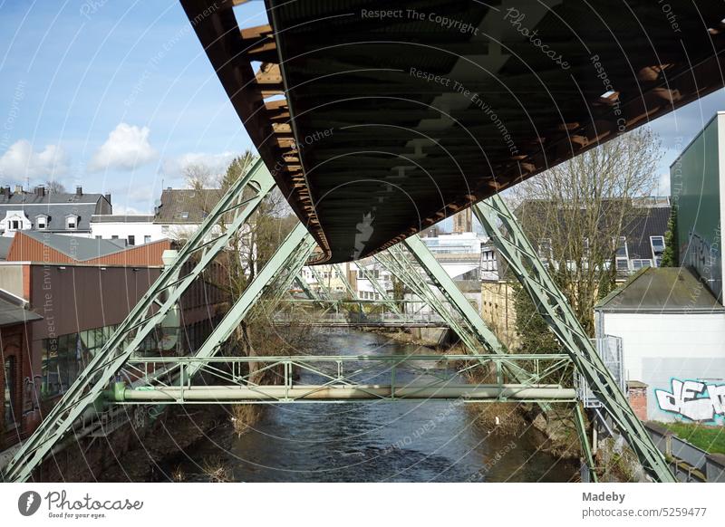 Steel girders of the track of the Wuppertal suspension railroad Over the Wupper river in springtime in the city center of Wuppertal in the Bergisches Land region of North Rhine-Westphalia, Germany
