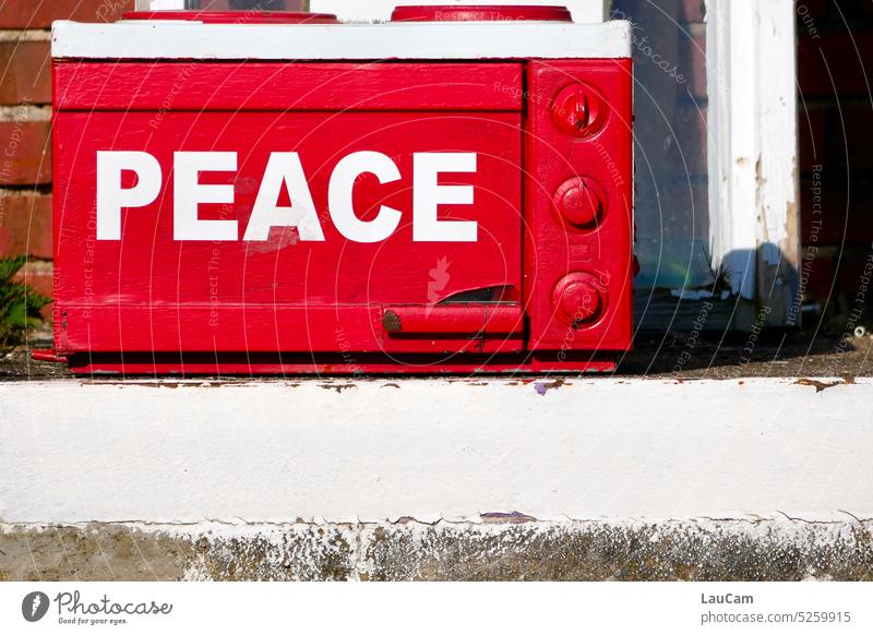 Peace - stands on a red microwave peace Desire Hope Peace Wish Solidarity War Ukraine Russia Conflict Freedom Sign Fairness protest Demonstration statement