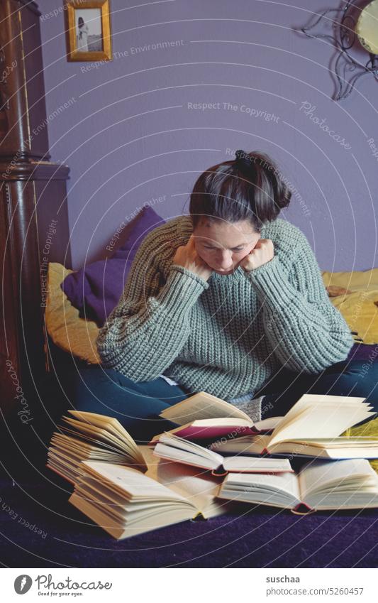 woman reads several books at the same time and is overwhelmed Reading Education labour smart Study learn by heart too much at once excessive demands