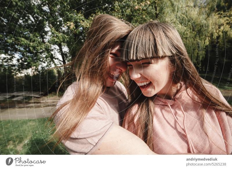 crazy young couple emotionally having fun, kissing and hugging outdoors. Love and tenderness, romance, family, emotions, fun. having fun together beach happy