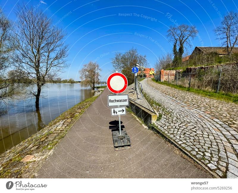 Passage forbidden with round traffic sign in front of blue sky in sunshine  at a construction site on a road in Blomberg in East Westphalia-Lippe,  Germany - a Royalty Free Stock Photo