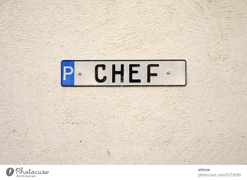 Metal sign with P CHEF on a bright wall / parking for the boss Parking lot Chief parking metal plate Special regulation Special treatment Blog Reserved
