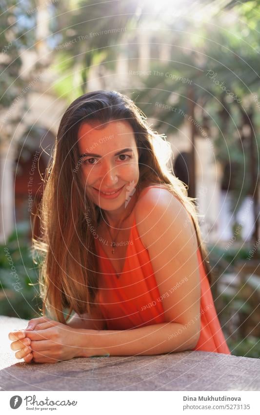 Happy young woman in red dress smiling and looking to the camera tilted perspective happy Woman Smiling Joy Adults portrait Laughter Lifestyle Human being