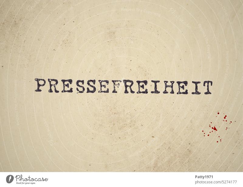 The word freedom of the press in typewriter font on dirty paper Word Text Typewriter font Blood Paper Blood splatter Typography Letters (alphabet) Characters