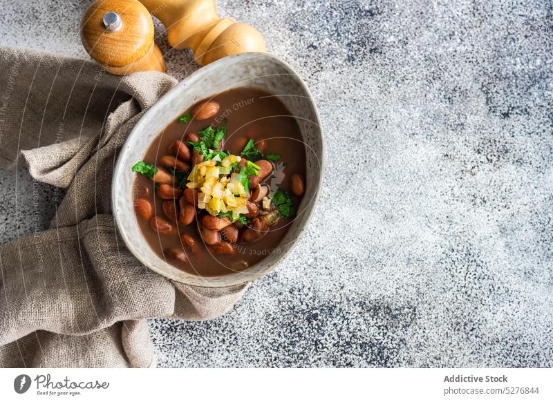 Bean vegetable soup served in the bowl background bean concrete coriander cuisine dinner bowl dish eat eating first dish food garlic gourmet herb lobio meal