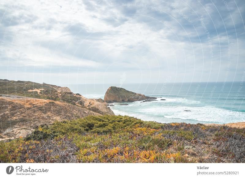 View of Alteirinhos Beach and the dry scenery near Zambujeira do Mar, Odemira region, western Portugal. Wandering along the Fisherman Trail, Rota Vicentina