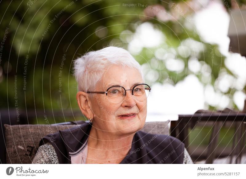Woman slightly skeptical & slightly amused Feminine Face Colour photo portrait skepticism Gray-haired Adults Senior citizen Human being Head Looking