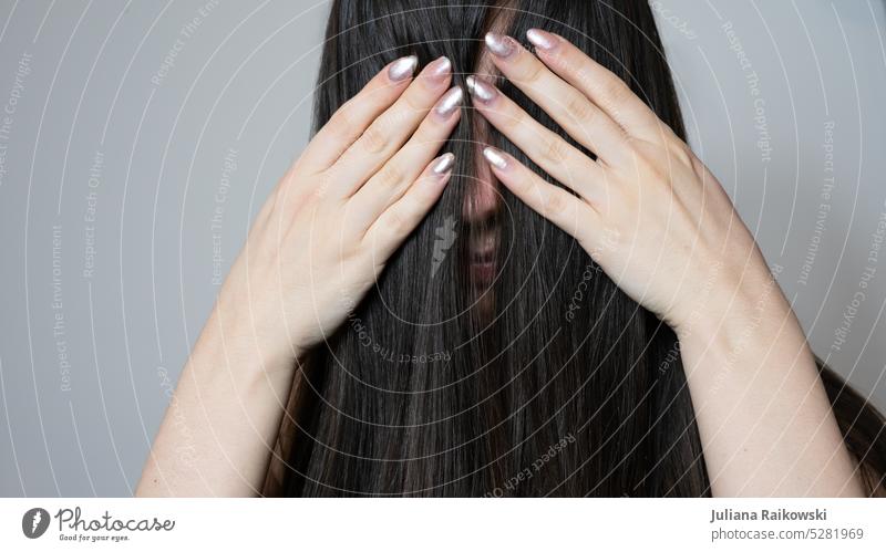 Woman holds her hair in front of her face Model Hide wisps long hairs Lady Human being Adults Young woman Youth (Young adults) feminine Lifestyle portrait