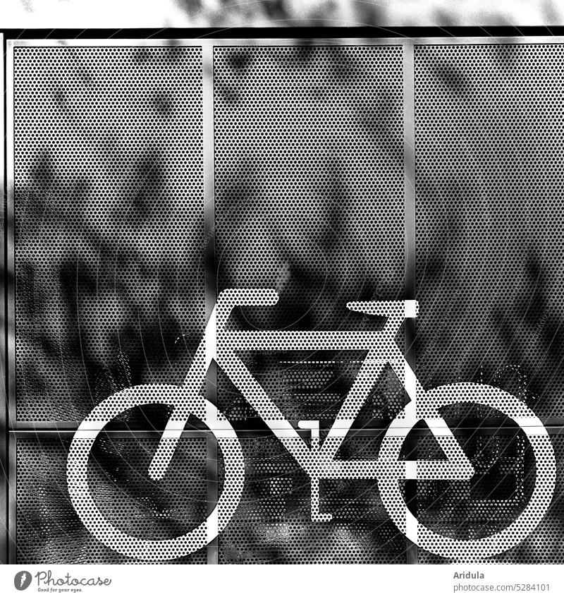 Bicycle parking station | picto wheel with shadow play b/w Cycling cyclist Transport turnaround Street Means of transport Mobility Lanes & trails Road traffic