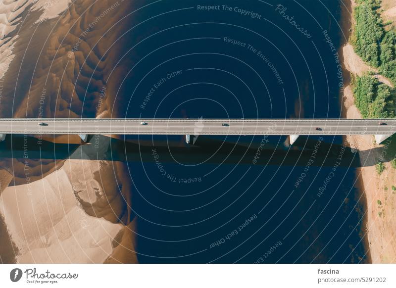 aerial car bridge over river with sandy dunes coast sunset beautiful ecology environment aesthetic amazing top view sustainable auto scenic riverside 4k