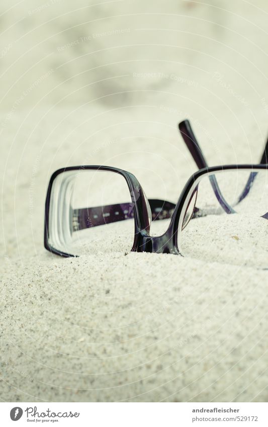 Baltic Sea. Eyeglasses Hip & trendy Sand Beach Spectacle frame Black Lie Relaxation Blind Eye test Colour photo Exterior shot Close-up Deserted Copy Space top